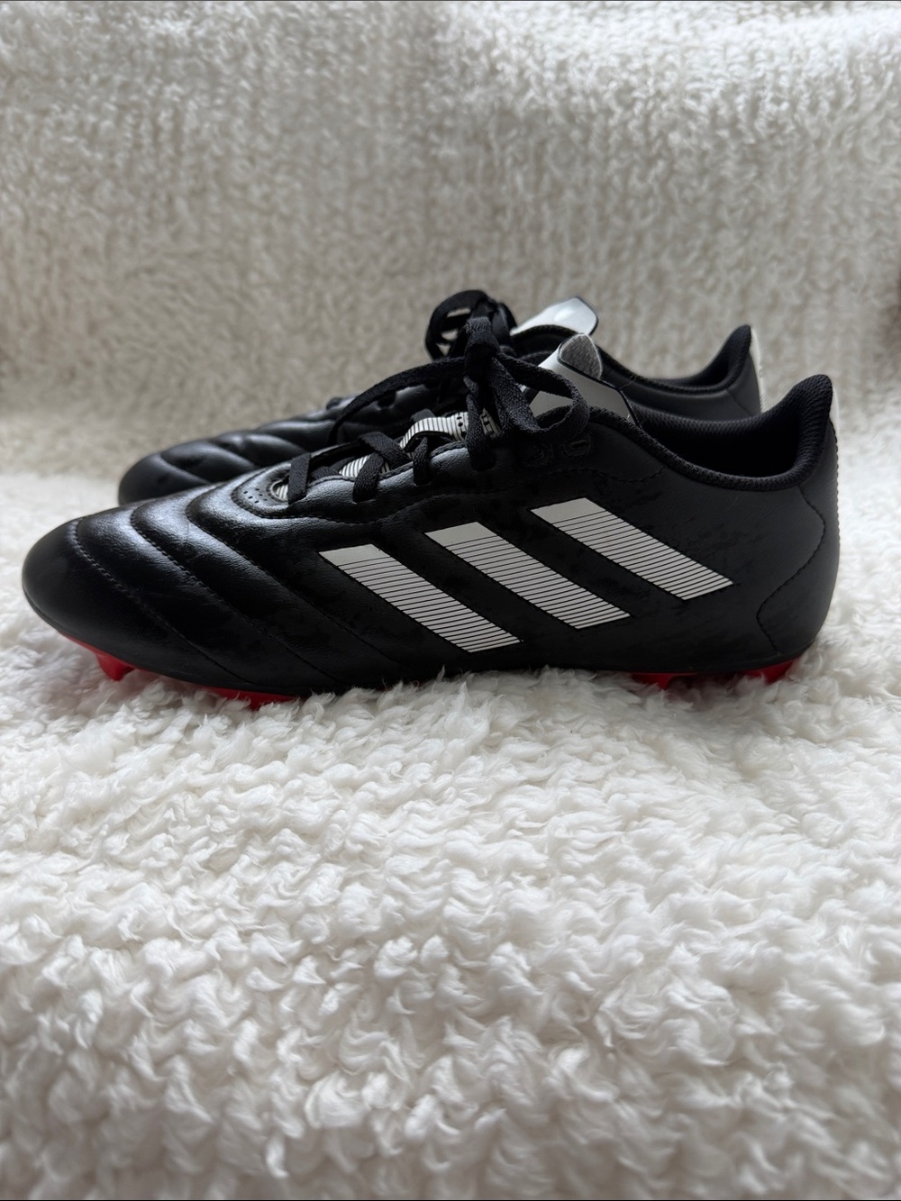 Adidas Black Men’s Soccer Cleats with White Stripes and Red Studs